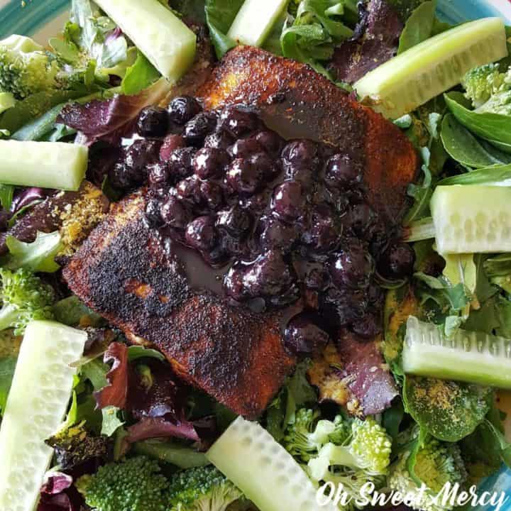 Salmon with Blueberry Sauce is a deeply nourishing dish that will make your brain happy! THM, low carb, keto friendly and all real food goodness. #lowcarb #thm #healthyfats #salmon