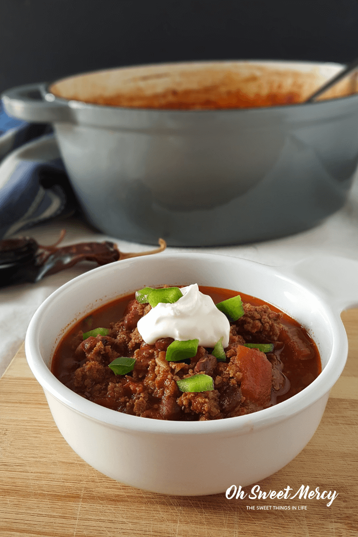 This Braised Chipotle Chili will fill your home with savory aromas and your belly with warming comfort. Make it low carb or low fat, a versatile family-pleasing dish for Trim Healthy Mama plan followers! #recipes #thm #chili #dutchoven #fallfoods #healthy #ohsweetmercy