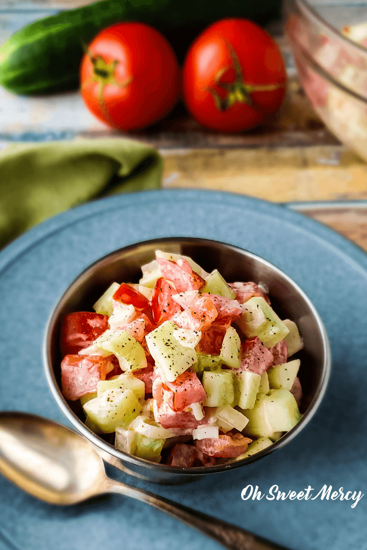 Close up of Creamy Cucumber Tomato Salad in a Bowl