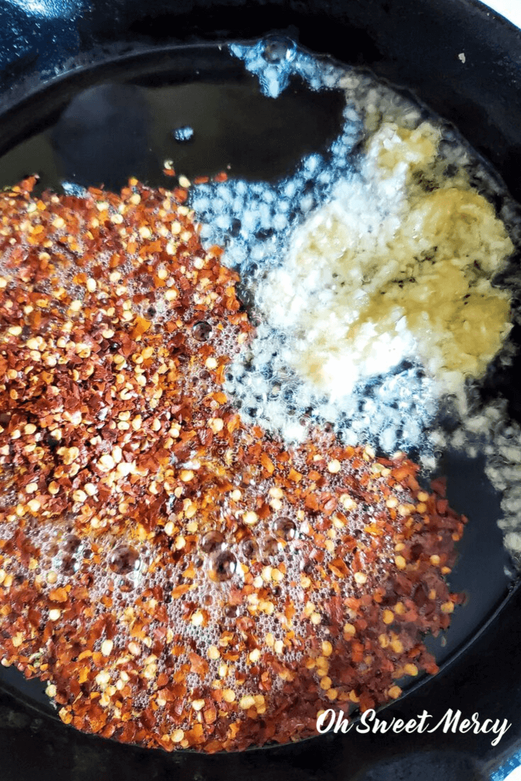 Cooking red pepper flakes and garlic in a skillet