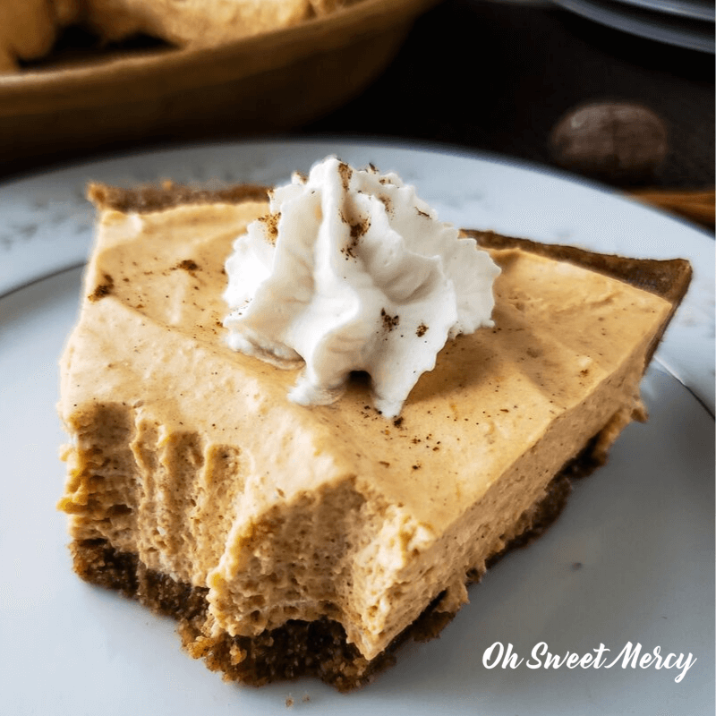 Slice of no bake pumpkin pie with bites taken out