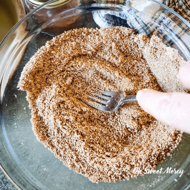 mixing dry ingredients together for the no bake gingersnap pie crust