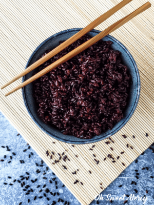 bowl of black rice with chopsticks