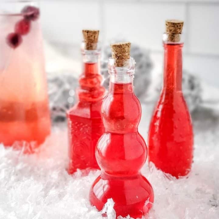 Sugar Free Cranberry Simple Syrup in decorative bottles