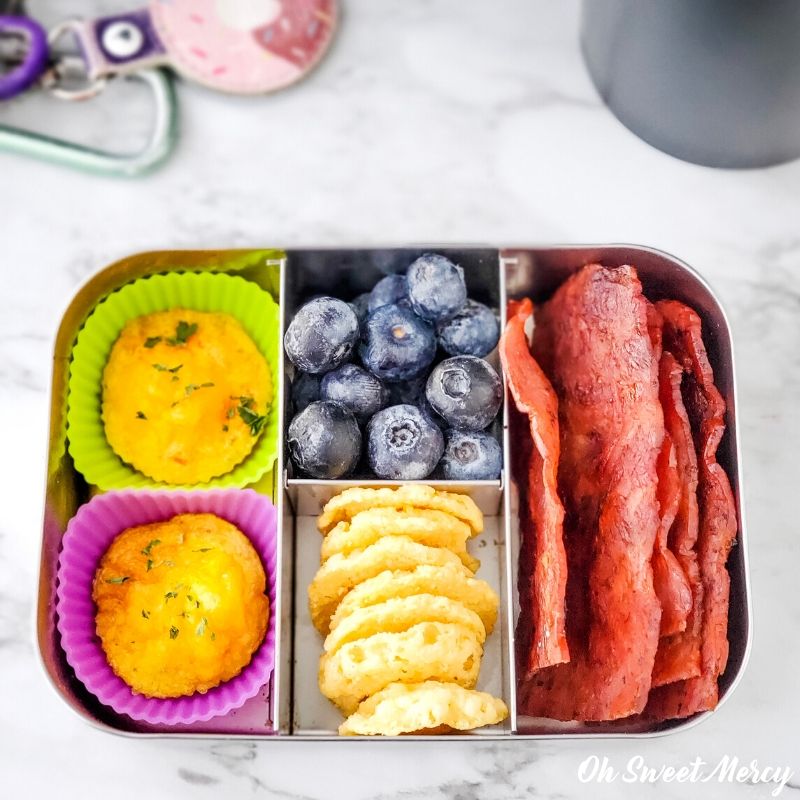 Breakfast on the go snack box - egg puffs, blueberries, cheese crisps, cooked turkey bacon.