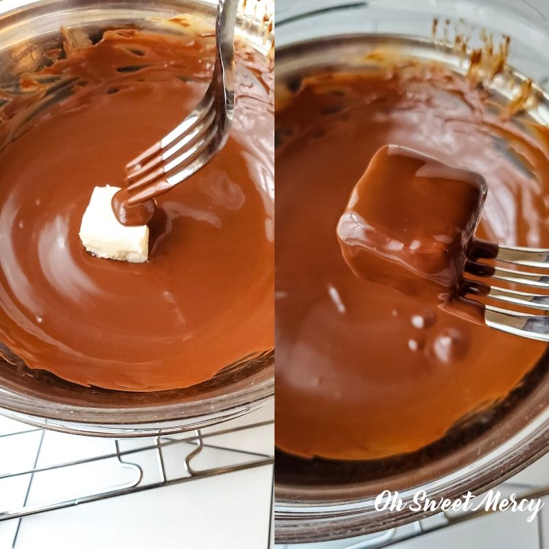 Coatng cheesecake bites in melted chocolate