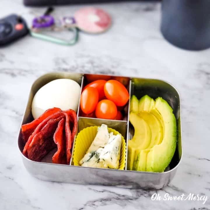 Cobb style snack box - hard cooked egg, cooked turkey bacon, cherry tomatoes, avocado slices, blue cheese.