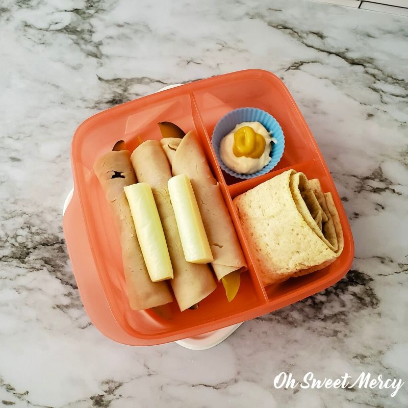 Deli Style Snack Box - dill spears wrapped with lean deli turkey, string cheese stick, low fat mayo and mustard, low carb lavash bread.