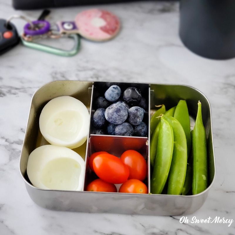 Light and lovely snack box - hard cooked egg white, cherry tomatoes, sugar snap peas, fresh berries.