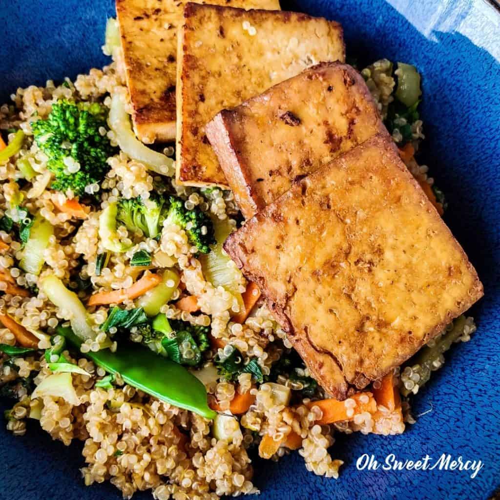 Close up of garlic ginger lime marinated tofu and quinoa