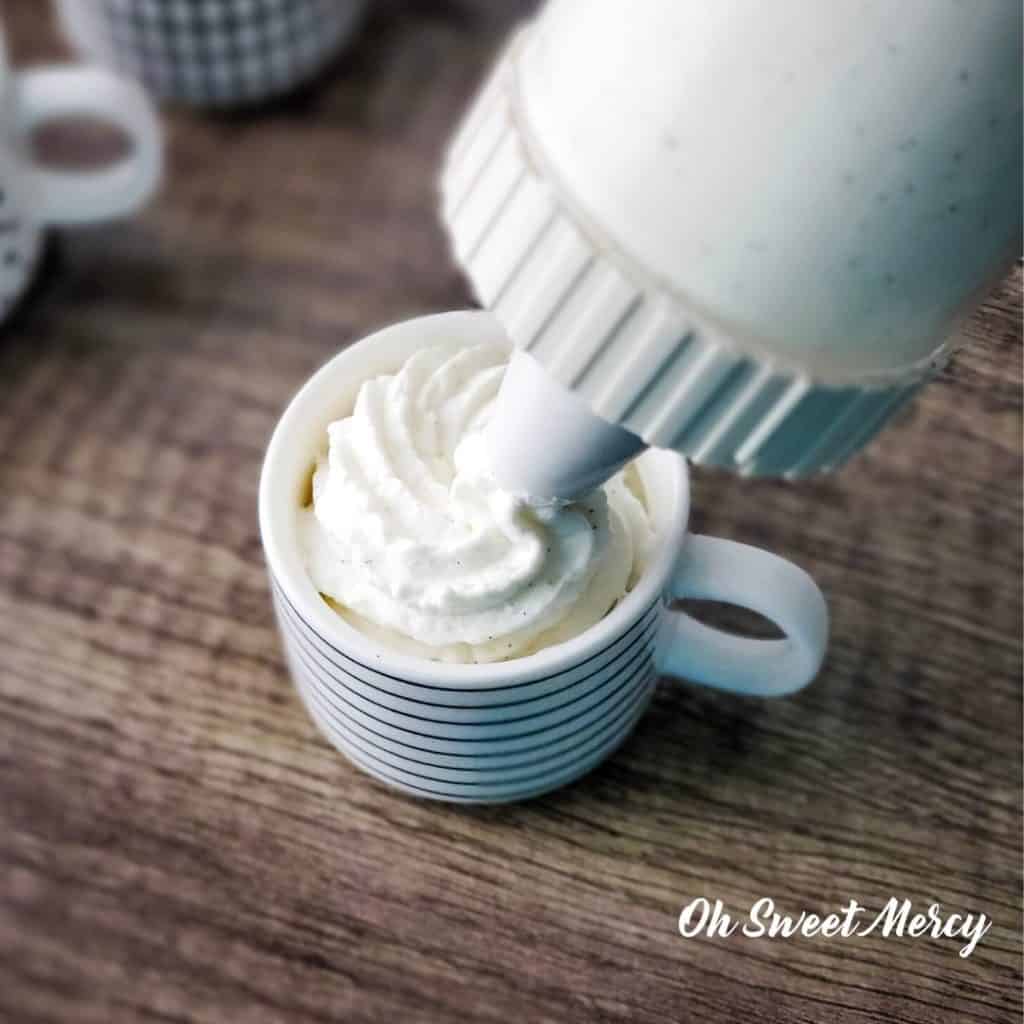 Piping vanilla bean mousse into cup