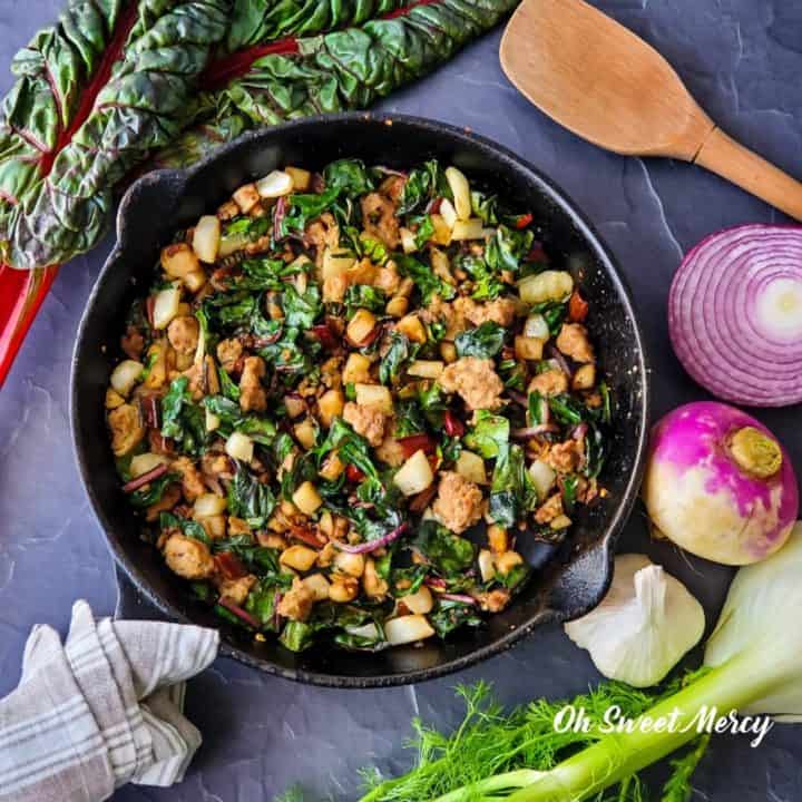 Cast iron skillet with turkey, fennel, and swiss chard hash