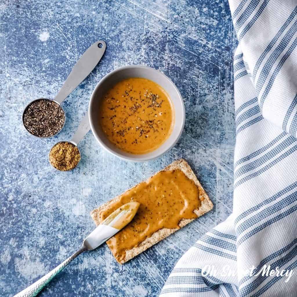 Peanut butter with flax and chia seeds on a wasa cracker