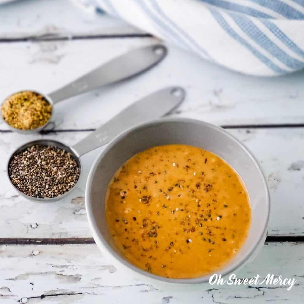 Bowl of peanut butter with flax and chia seeds spread