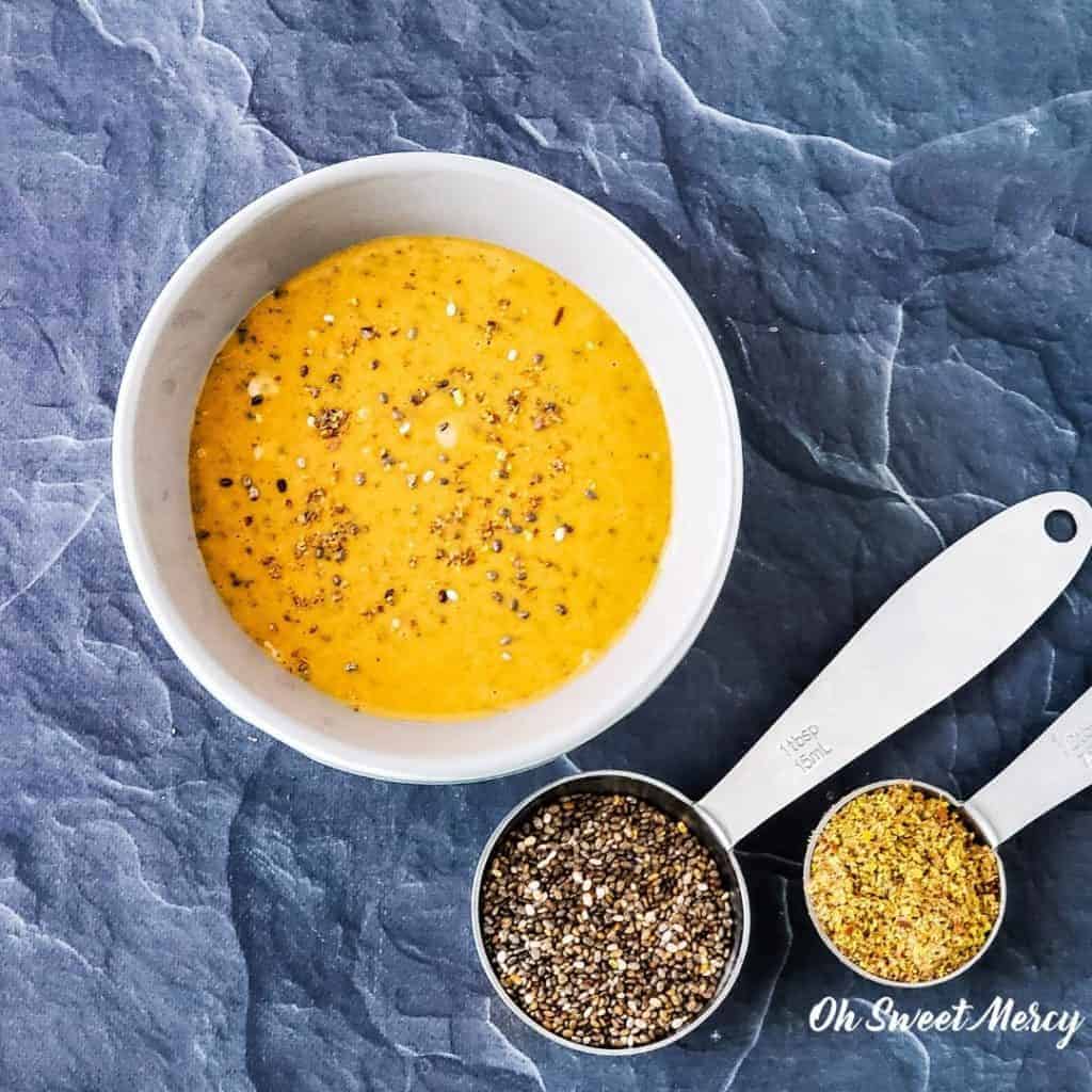 Bowl of peanut butter with flax and chia seeds spread