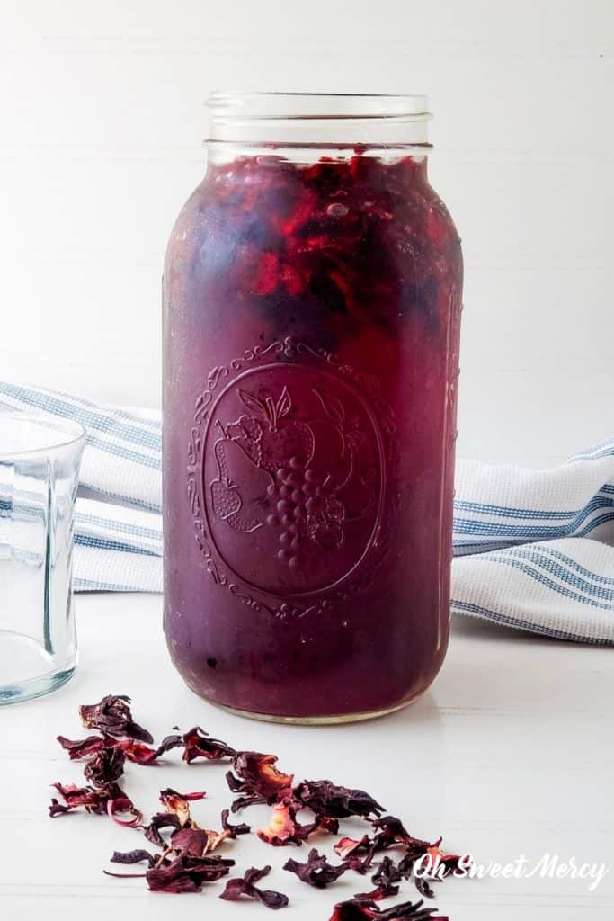 2 quart mason jar with water and hibiscus flowers