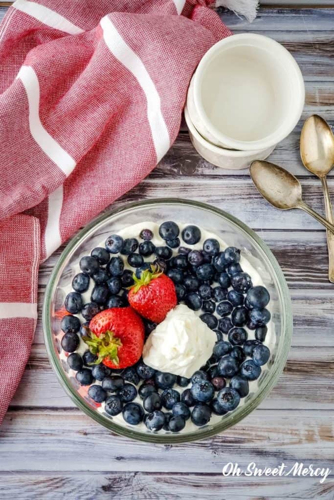 Overhead view of bowl of layered berry dessert