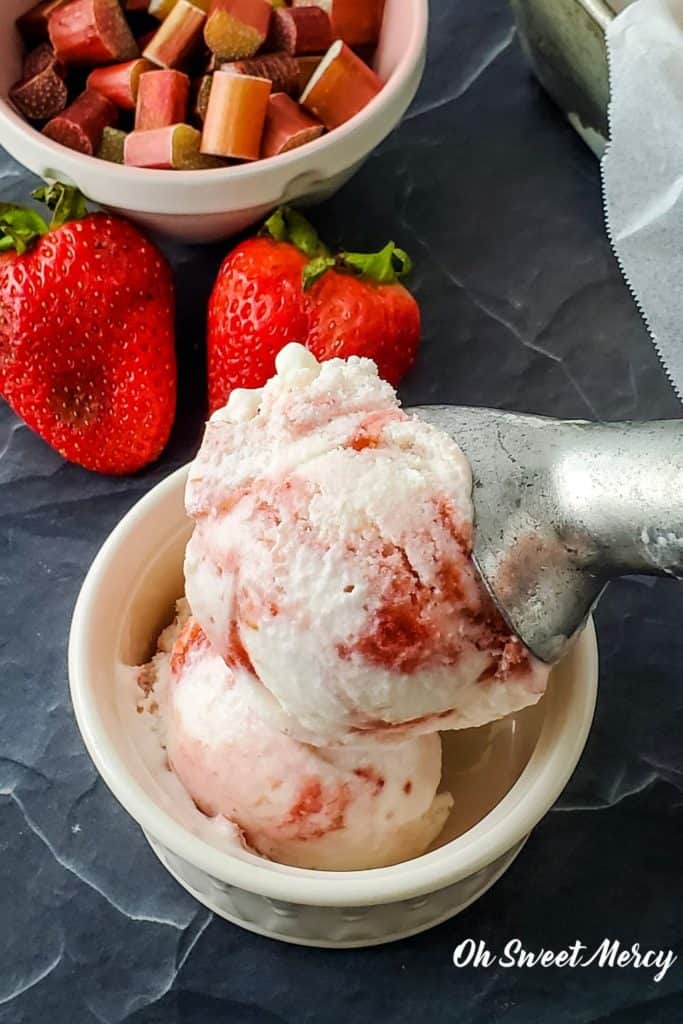 Scoop of low carb strawberry rhubarb swirl ice cream