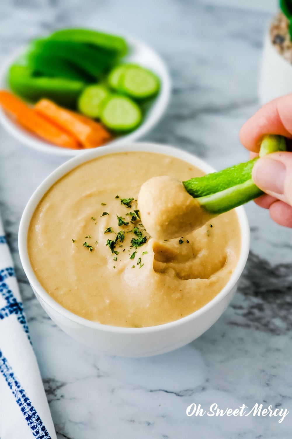 Dipping pepper strip into bean dip