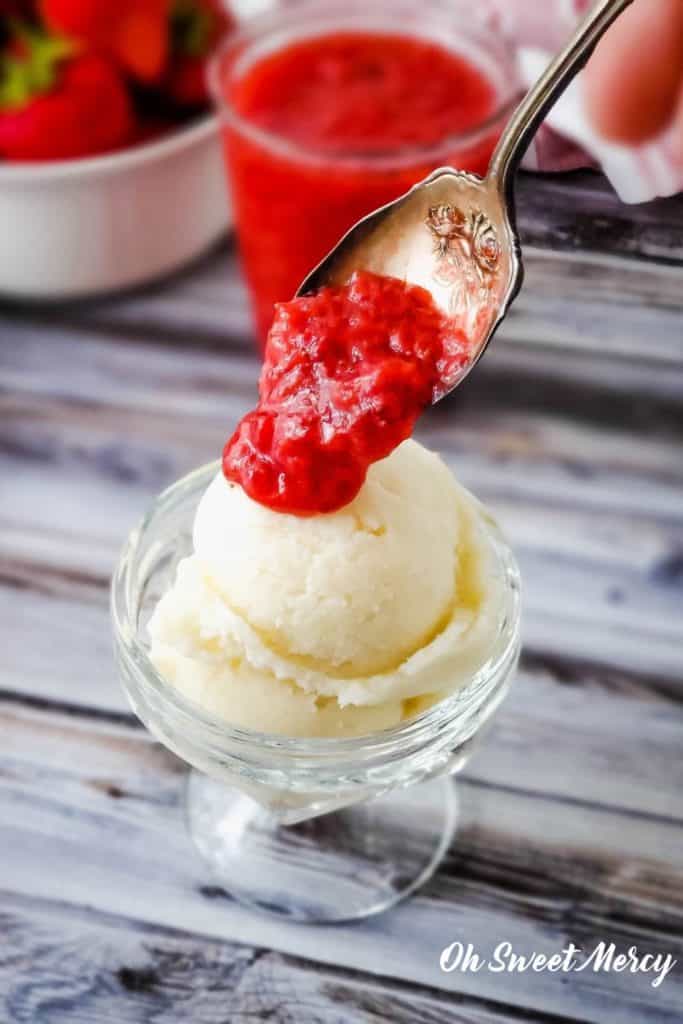 Spooning sauce over ice cream