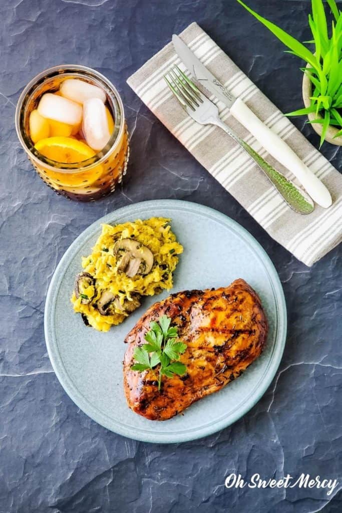 overhead shot of chicken and spaghetti squash on blue plate