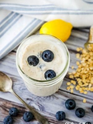 Pint jar of overnight oats with blueberries on top