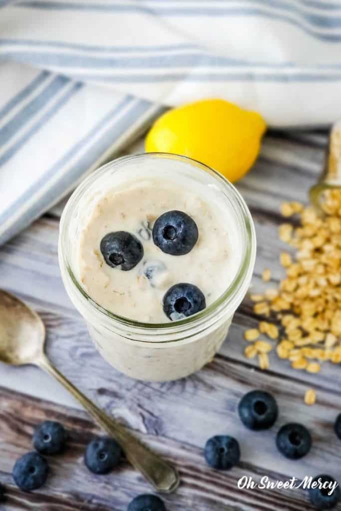 Pint jar of overnight oats with blueberries on top