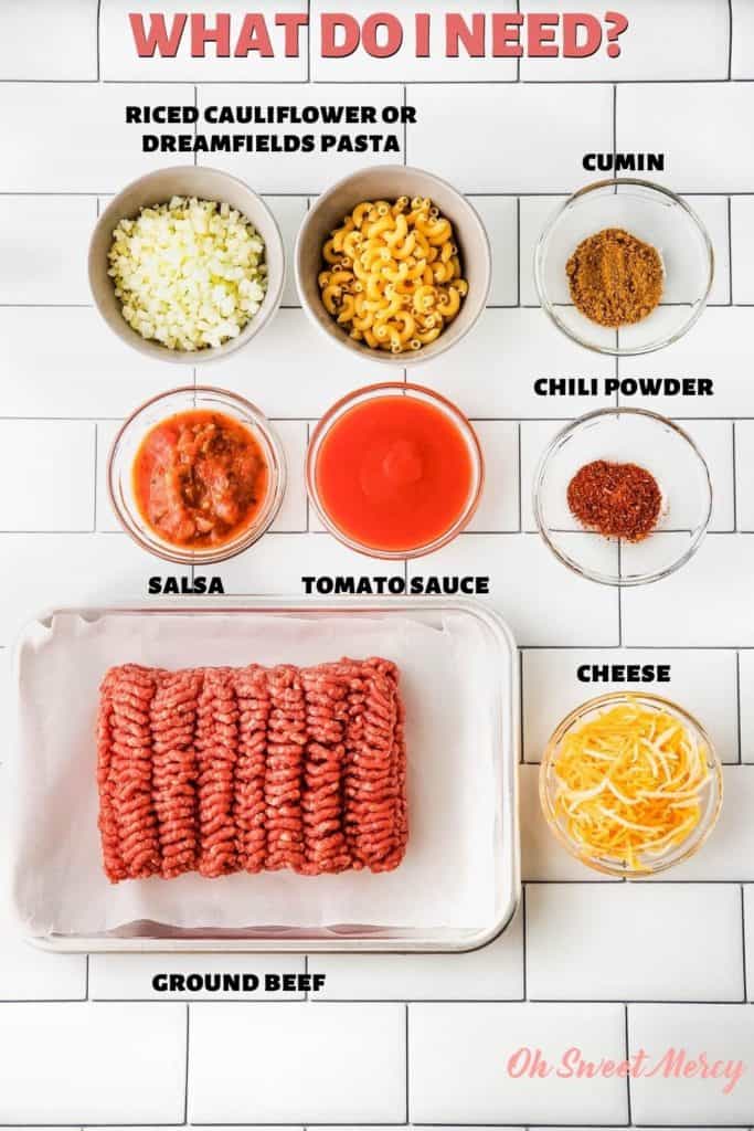 Low Carb Taco Skillet Ingredients: riced cauliflower OR Dreamfields pasta, salsa, tomato sauce, ground beef, cumin, chili powder, cheese