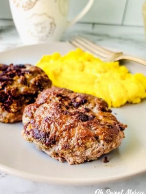 Close up of sugar free breakfast sausage patties with scrambled eggs