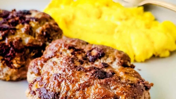 Close up of sugar free breakfast sausage patties with scrambled eggs