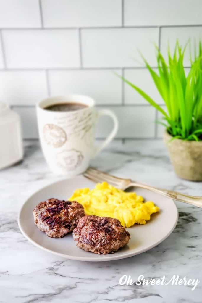 Plate of sausage patties and eggs for breakfast