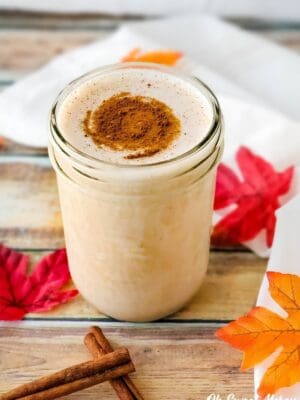 Pint mason jar with low carb Maple Cinnamon Protein Shake with cinnamon sprinkled on top