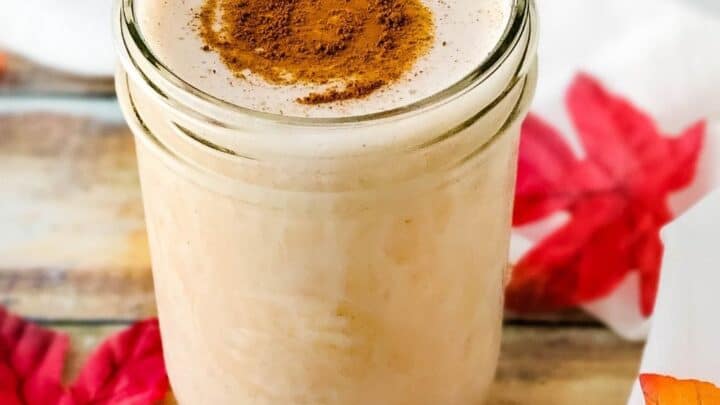 Pint mason jar with low carb Maple Cinnamon Protein Shake with cinnamon sprinkled on top