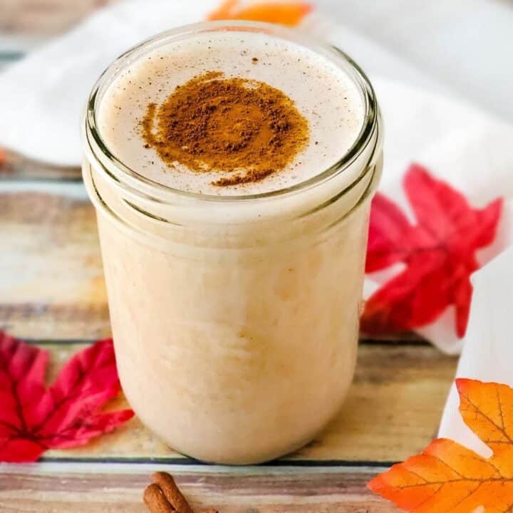 Pint mason jar with low carb Maple Cinnamon Protein Shake with cinnamon sprinkled on top