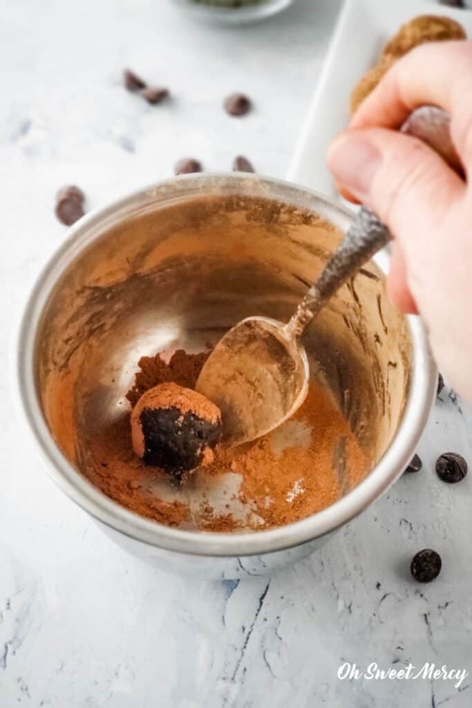 Rolling protein ball in cocoa powder