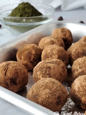 Cocoa coated Secret Peppermint Chocolate Protein Balls on a tray