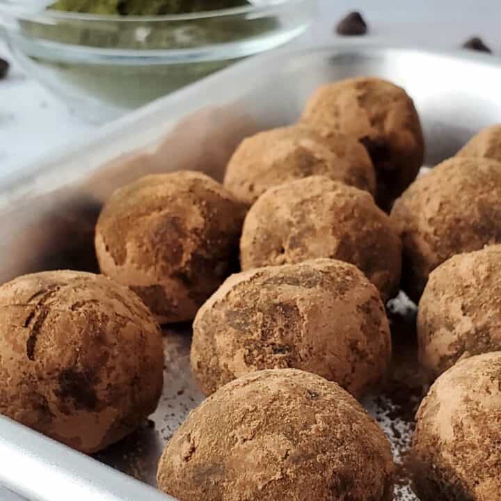 Cocoa coated Secret Peppermint Chocolate Protein Balls on a tray