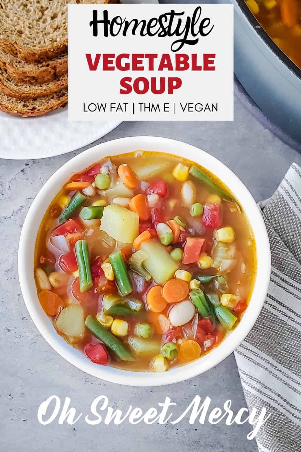 My Homestyle Vegetable Soup is packed with veggies and flavor but not fat! A healthy and delicious THM E soup, but easily tweaked to fit S or FP styles if needed. Up your plant-based meals game this year with this hearty and tasty veggie soup. #lowfat #healthycarbs #thm #vegan #vegetarian #homemade #soups