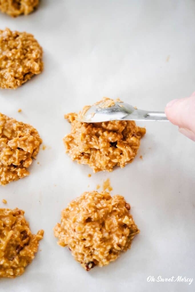 Spooning cookie mixture onto baking sheet