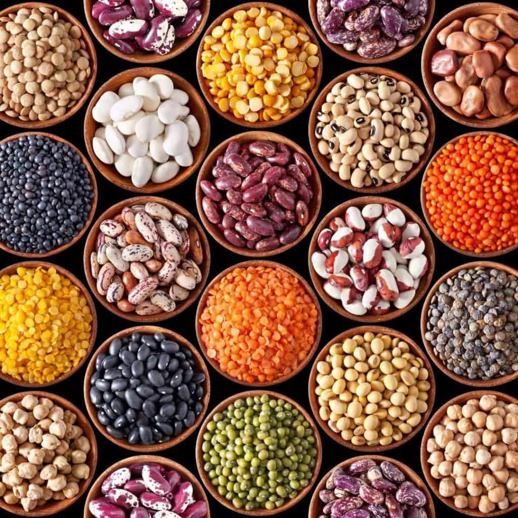 photo with many different types and colors of dry beans and legumes