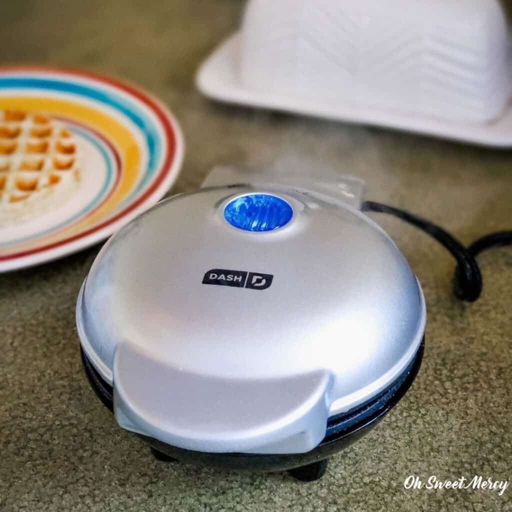 mini waffle maker closed and cooking waffles