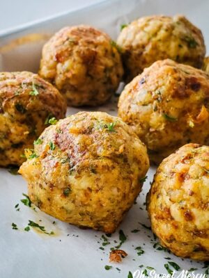 Close up of cooked turkey meatballs on baking sheet