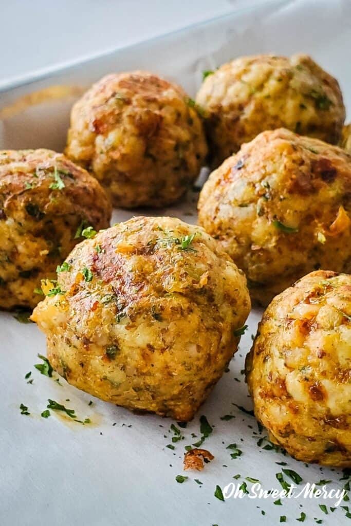 Close up of cooked turkey meatballs on baking sheet