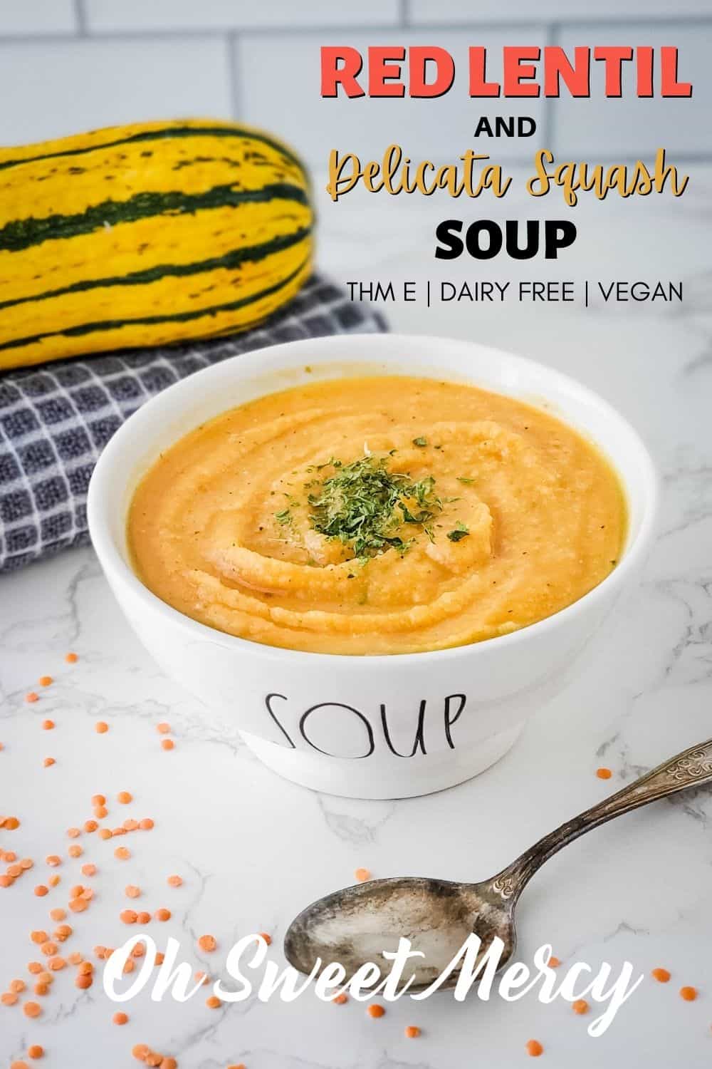 My Red Lentil and Delicata Squash Soup is a warm bowl of comfort food that's kind to your waistline. Delicata squash lends just a hint of sweetness to this soup, and just a few other simple ingredients come together for a thick, creamy (but dairy free) blended soup that will warm your soul. Very low in fat, it's a perfect THM E recipe, too. #lowfat #healthycarbs #vegan #vegetarian #dairyfree #lentilsoup #redlentilsoup #trimhealthymamarecipes #healthy #soups @ohsweetmercy