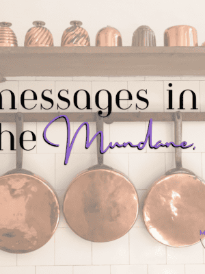 TEXT: messages in the mundane over copper pots and pans hanging on a white wall.